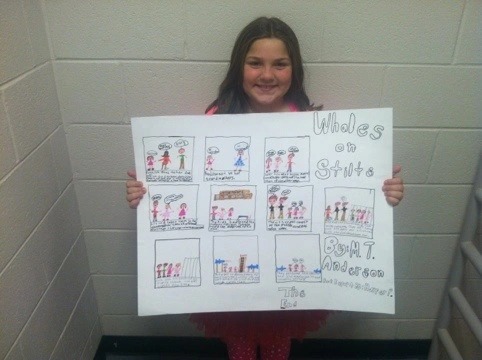 A miss kiosks holding a comic strip book report as an example of creative order report ideas